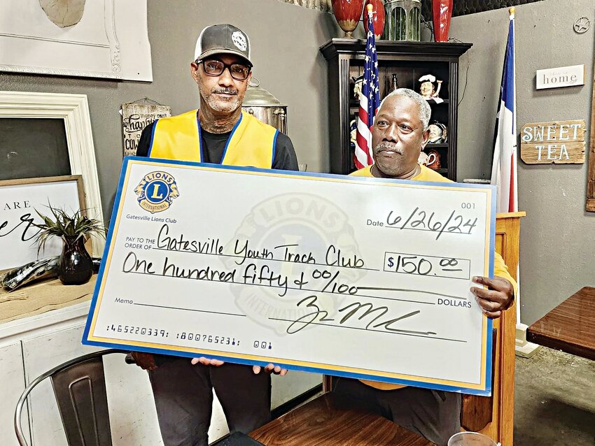 During a recent meeting, the Gatesville Lions Club awarded the Gatesville Youth Track Club with a $150 check. The donation will go toward purchasing a canopy for the kids to protect them from the sun during track season. Pictured is lions club member Jeremy Stills (left) presenting Don Ford, track club coach, with the check.