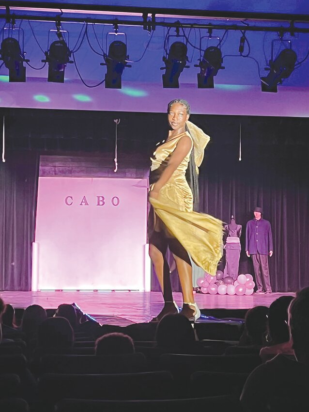 A student is pictured walking down the runway during last year's fashion show at Gatesville High School.