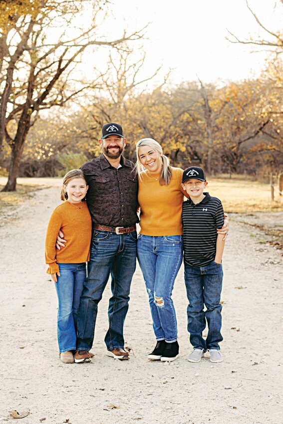 Katy is pictured with her husband, Chad, and children, Brock and Ruby.