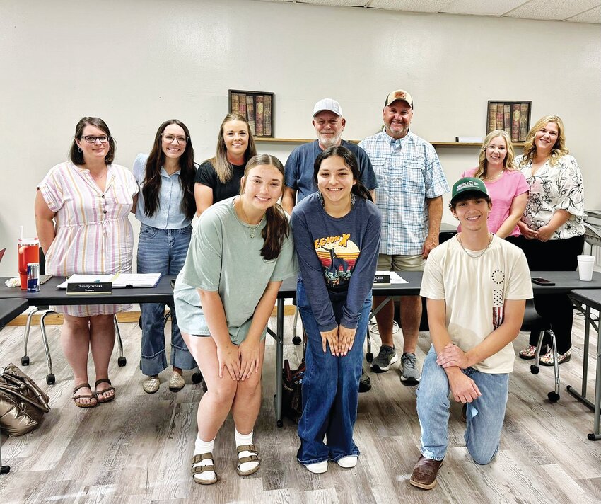 Evant ISD Board of Trustees is pictured (back row) with its newest board members, Lura Taylor (second from right) and Katie Teubner (far right). The Evant High School FFA Range team is also pictured (front row).