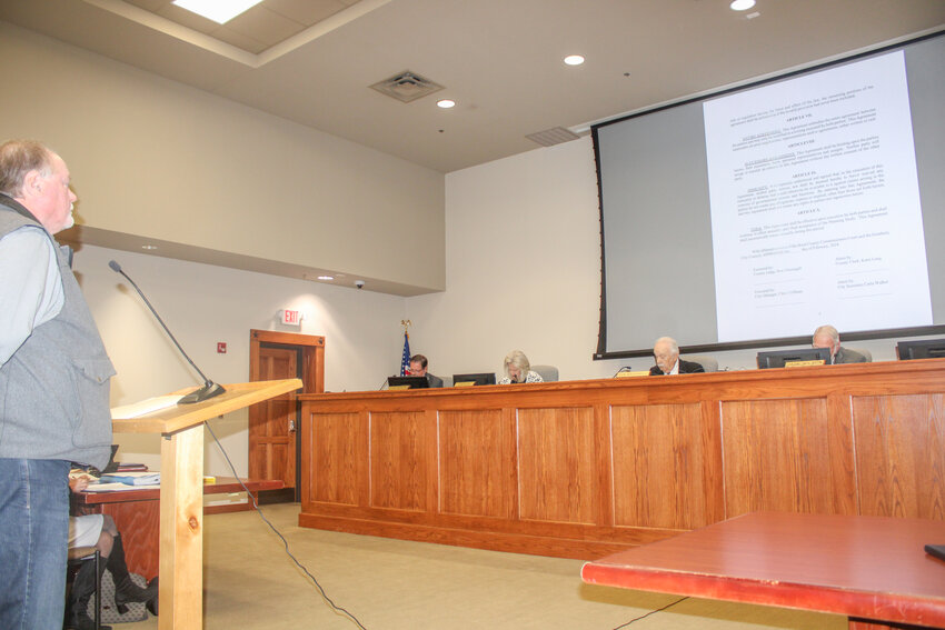 City Manager Chris Coffman speaks to the Hood County Commissioners Court about the interlocal agreement between the city and the county regarding Old Granbury Road improvements during the court’s regularly scheduled meeting on March 26.