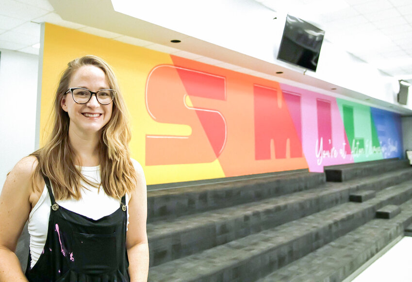 Local artist Reagan Deming was asked by Acton Elementary Principal Maggie Walton to paint a mural inside the school to celebrate learning and encourage young minds. One section of the mural depicts the words, “Smile, you’re at Acton Elementary School,” in colorful, bold letters.