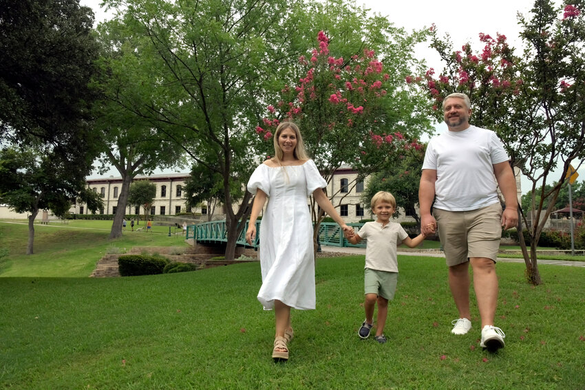Oksana Tyshchenko, her husband Max Grabov, and their son Yegor enjoy a stroll through Shanley Park.