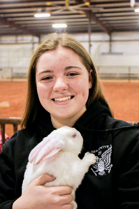Audrey Dunstan in January at the Hood County Livestock Show with one of her rabbits.