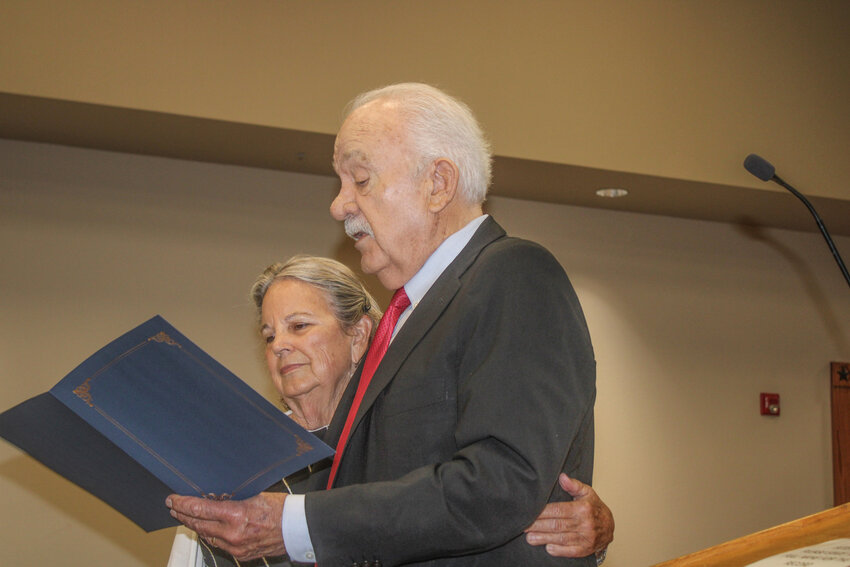 Hood County Judge Ron Massingill reads the proclamation for Elder Abuse Awareness Month with longtime Hood County Commissioners Court attendee Faye Landham during a regular meeting May 27.