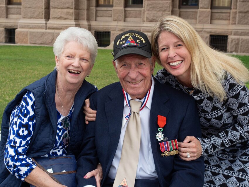 Patricia and Harry Whisler, and his daughter Debbi, are all smiles as they honored his service together.