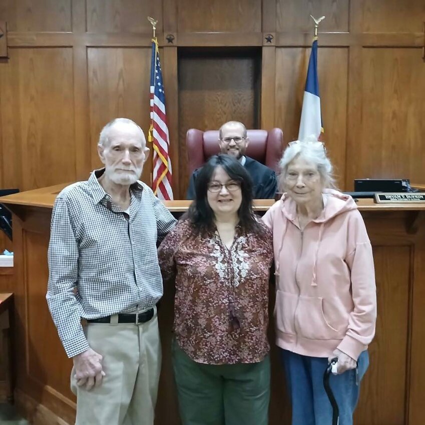 Mendy Torres, middle, was legally adopted by her stepfather Kevin Tipton, left, on Feb. 16. Also pictured is Torres’ mother, Angie Tipton, and Judge Bryan Bufkin.