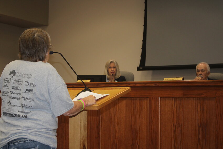 Granbury resident Tina Brown asks questions regarding the Hood County Fund Balance Policy to Precinct 2 Commissioner Nannette Samuelson during a regularly scheduled meeting of the Hood County Commissioners Court May 14.