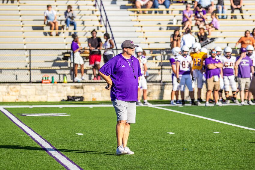 Granbury’s new head football coach Bobby Hill leads the scrimmage.