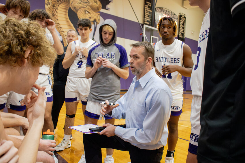 Coach Andy Atkins giving the Rattlers a pep talk during a time out during the 2024-2025 season.