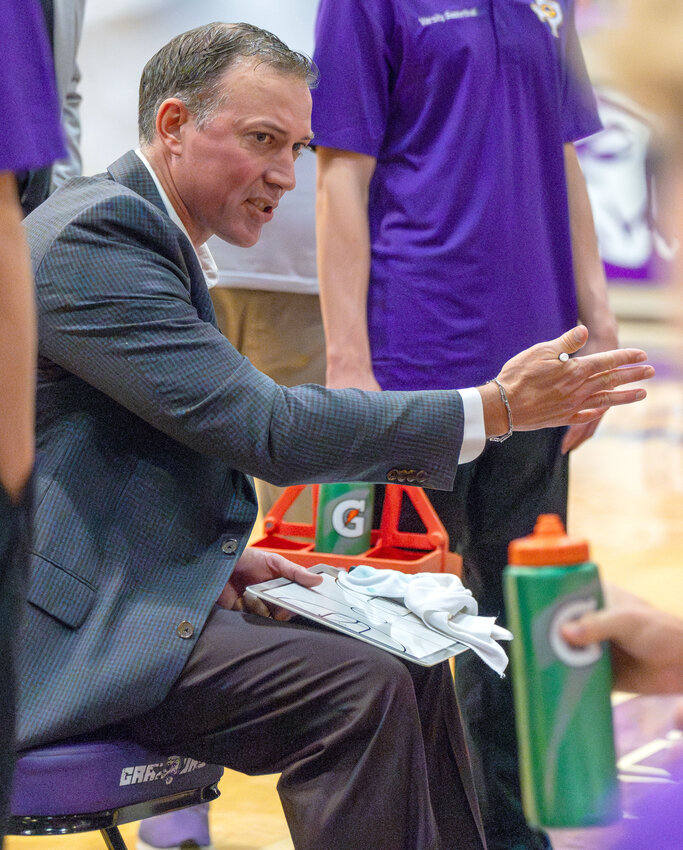 Granbury boys basketball head coach Jeremy McFerrin speaks with his team during a timeout. McFerrin is from Lubbock and, since starting his coaching journey in the Panhandle, has moved down the Lone Star State with his previous positions being in the DFW metroplex. Now he is in North-Central Texas, where the change of pace has been great for the whole family.