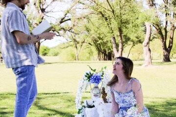 John David Dvorak proposes to Eme Looney recently. The couple play Mr. Darcy and Elizabeth Bennet in “Pride and Prejudice,” which hits the Granbury Opera House stage May 9.