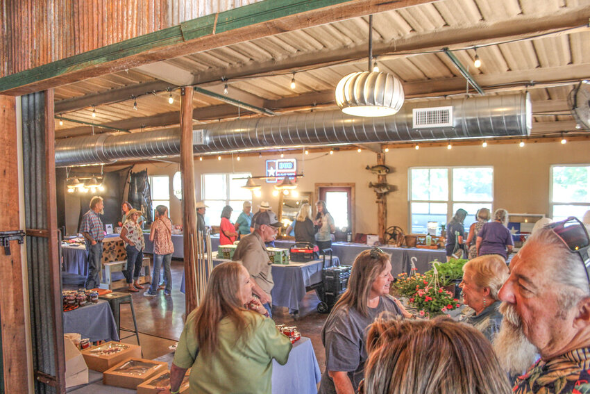 Friends and supporters of the Harkin family filling the barn and bidding on silent auction items.