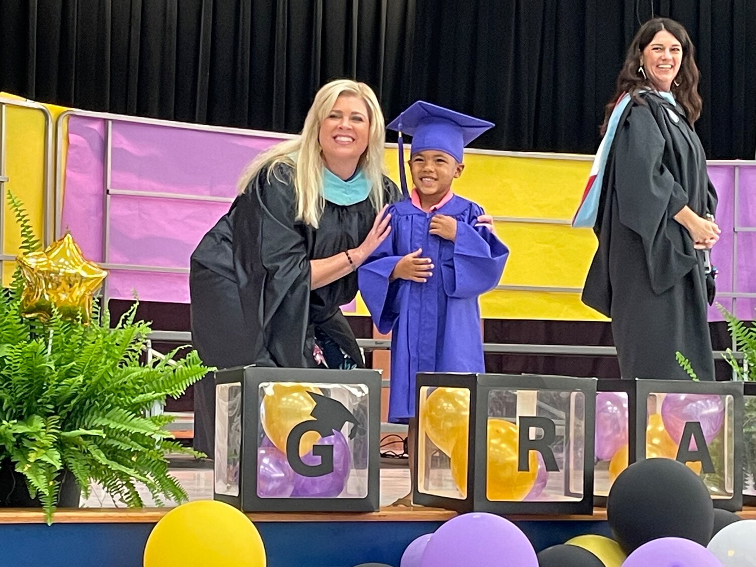 A total of 150 Brawner Elementary students graduated from kindergarten on Friday, May 19, with each student receiving a hug from Assistant Principal Sandy Ruiz, right, and Principal Jincy Ross, far left, when they crossed the stage. 