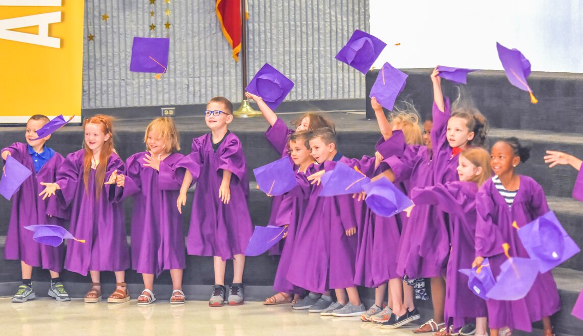 Following the presentation of the diplomas during the Acton Elementary School kindergarten graduation on Tuesday, May 23, the graduates tossed their caps into the air, igniting smiles and giggles from everyone in attendance.