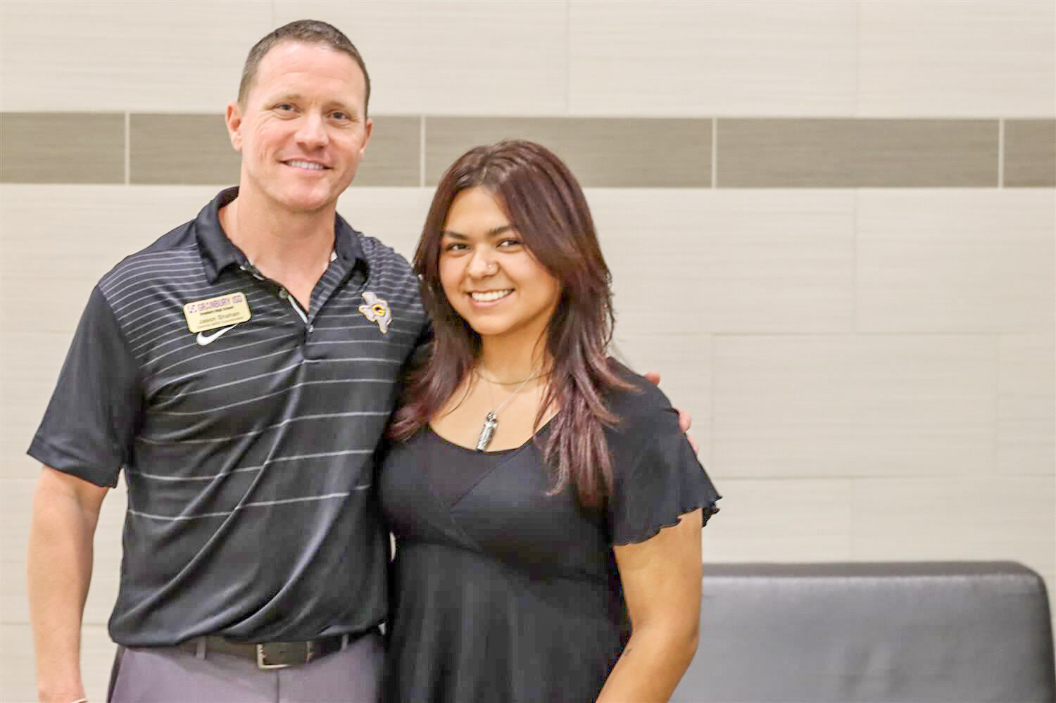 Jason Shahan, left, AVID teacher at Granbury High School, poses with senior Victoria Rodriguez, who was the first student in the district to receive a Dell scholarship from the Michael &amp; Susan Dell Foundation. 