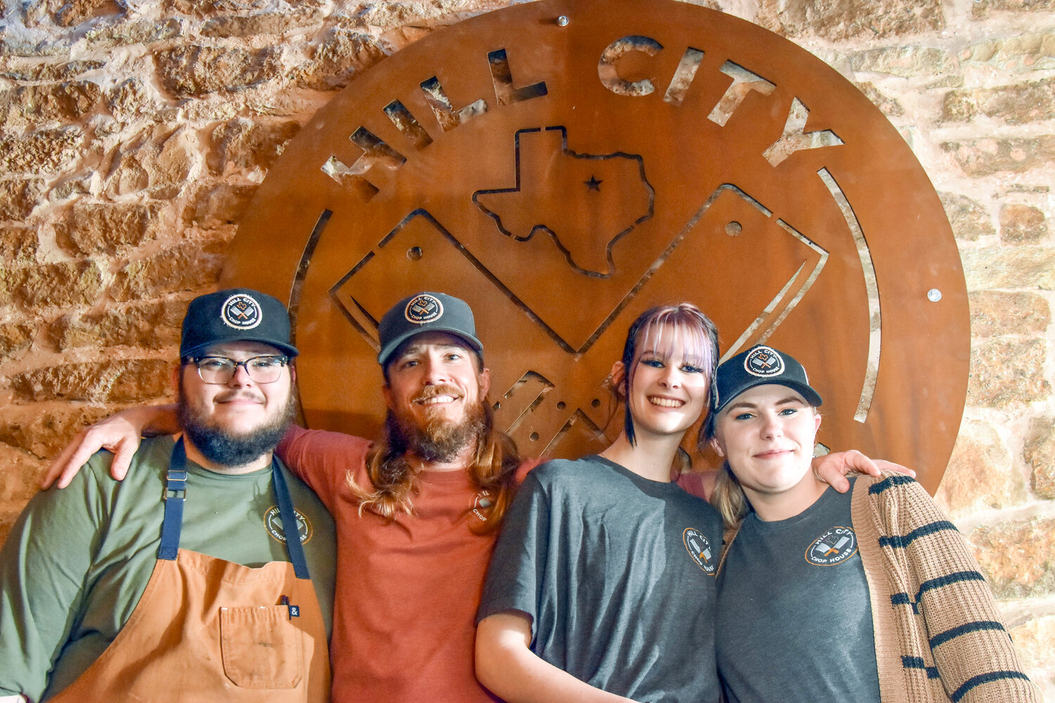 The Hill City Chop House crew includes, from left, Jack Allison, owner Dustin Martin, Cadence Lewis, and Mara Hall. The Tolar restaurant is open Thursday-Sunday and sometimes offers live music.