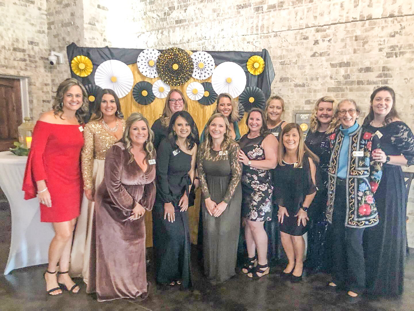 Staff members of the Paluxy River Children’s Advocacy Center get ready to welcome guests during last year’s winter gala event at La Bella Luna.