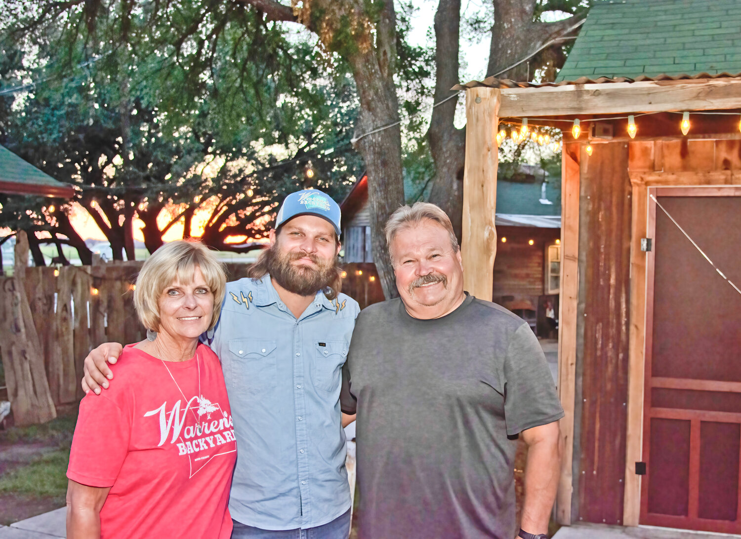 FAMILY ROOTS: The Berry family's roots in Hood County go way back. Here, Brett Berry, center, poses with mom Joni and dad Steve, the previous owners of Warren's Backyard.