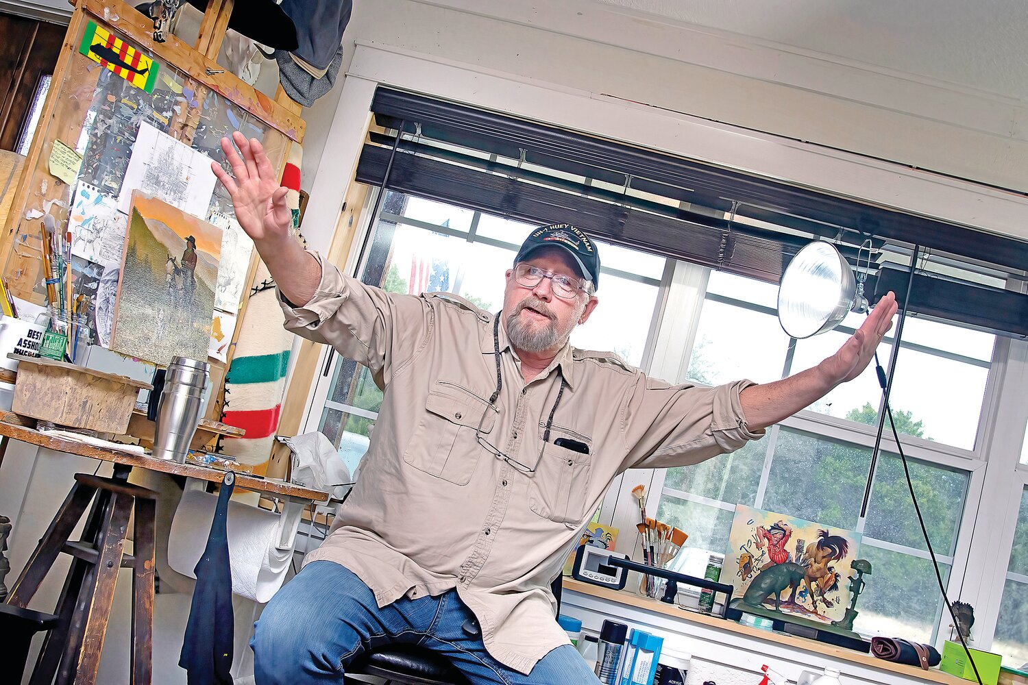 ANIMATED STORYTELLER: Vietnam veteran Mike Scovel speaks of his artwork with a glimmer in his eyes and a smile on his face, noting that he has been doodling and drawing for as far back as he can remember — even getting in trouble for writing on the walls when he was a child. 