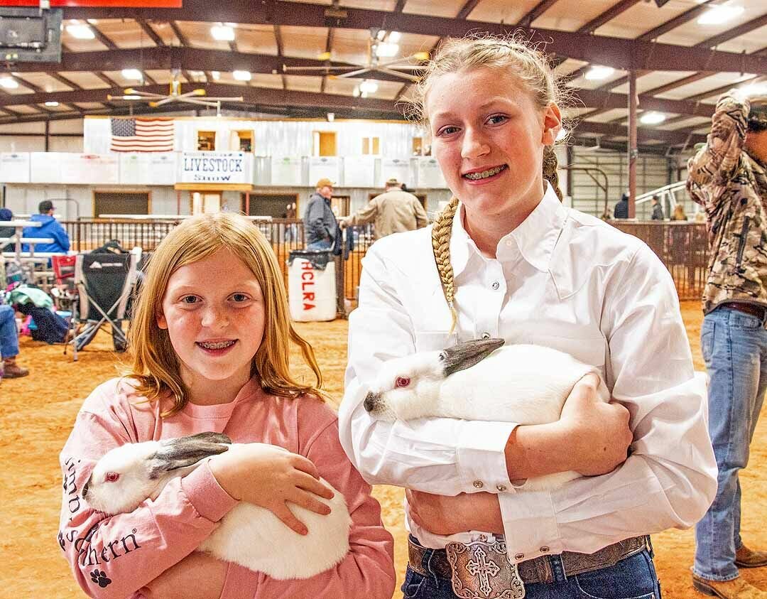 RABBIT TALES: Kyli Meyer and Audry Dobbs spent some of their time before the show discussing rabbits and their care.