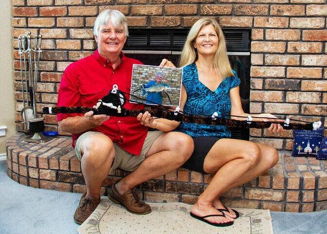 ELITE ANGLERS: There are just 49 saltwater Texas Elite Anglers and fewer than 100 freshwater fishermen who have earned the honor, and Barry and Karen Osborn are on both of those lists. Here they hold Barry's pipe cleaner fishing pole that was featured in the latest copy of Ripley's Believe it or Not.