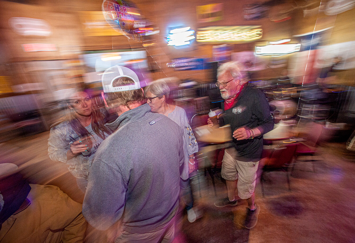 James Brock, right, is on constant motion at Brock’s Food and Drink. This tavern owner has built a place known for his barbecue and hospitality.