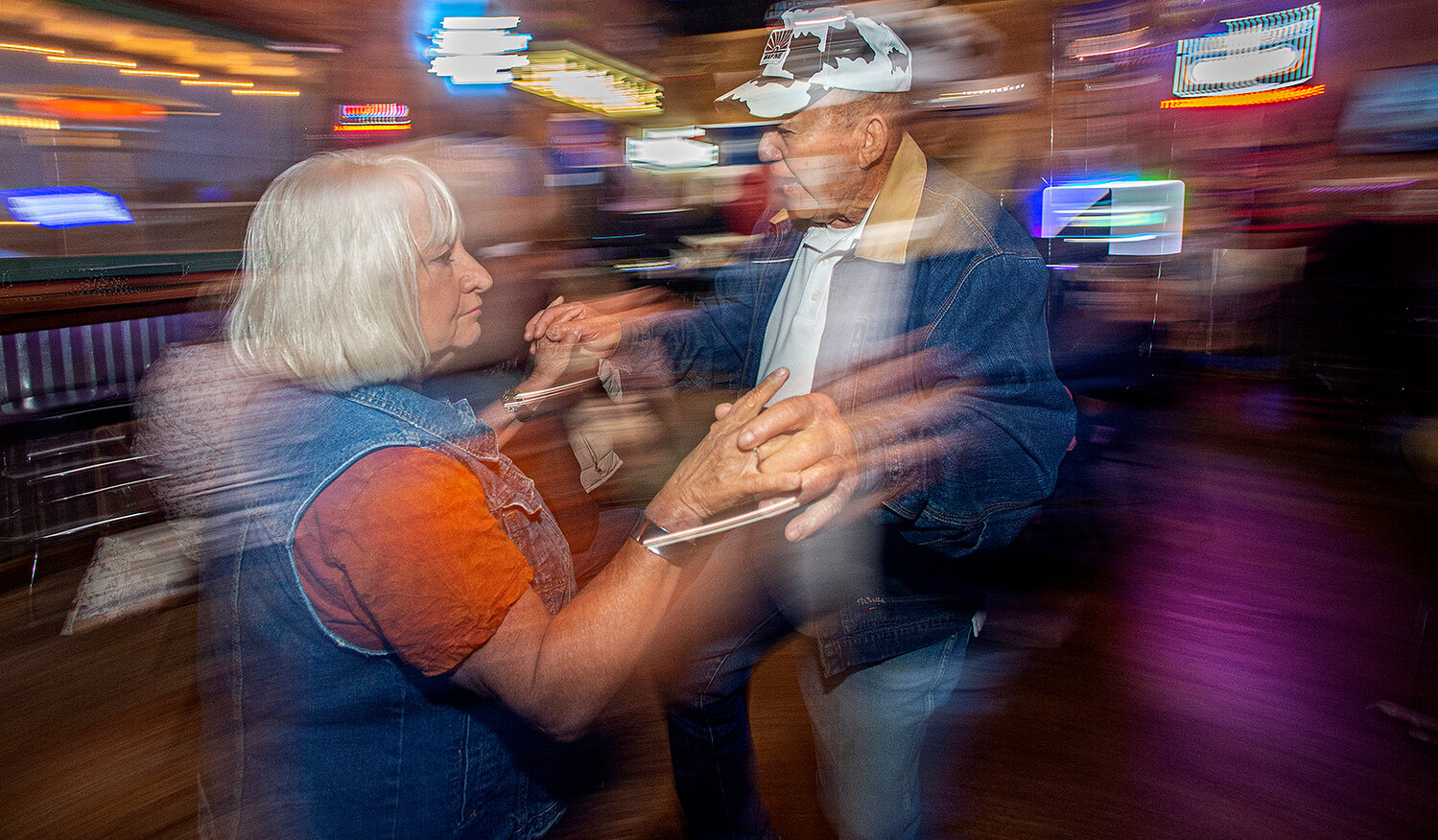 Judy Stone, 71, and her friend Andrew Andrews, 83, both from Joshus, Texas, hit the floor swinging.
