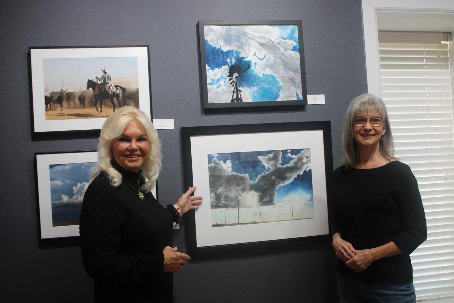 Vickie Guthrie, and Dawn Milson study the different art pieces on display at the Shanley House Gallery that showcase Texas at its finest.