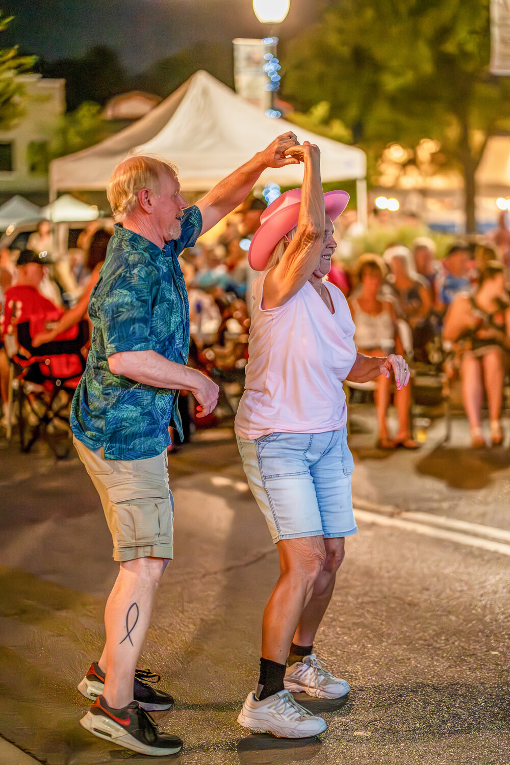 Older couple dancing during the Labor Day weekend street dance Saturday night