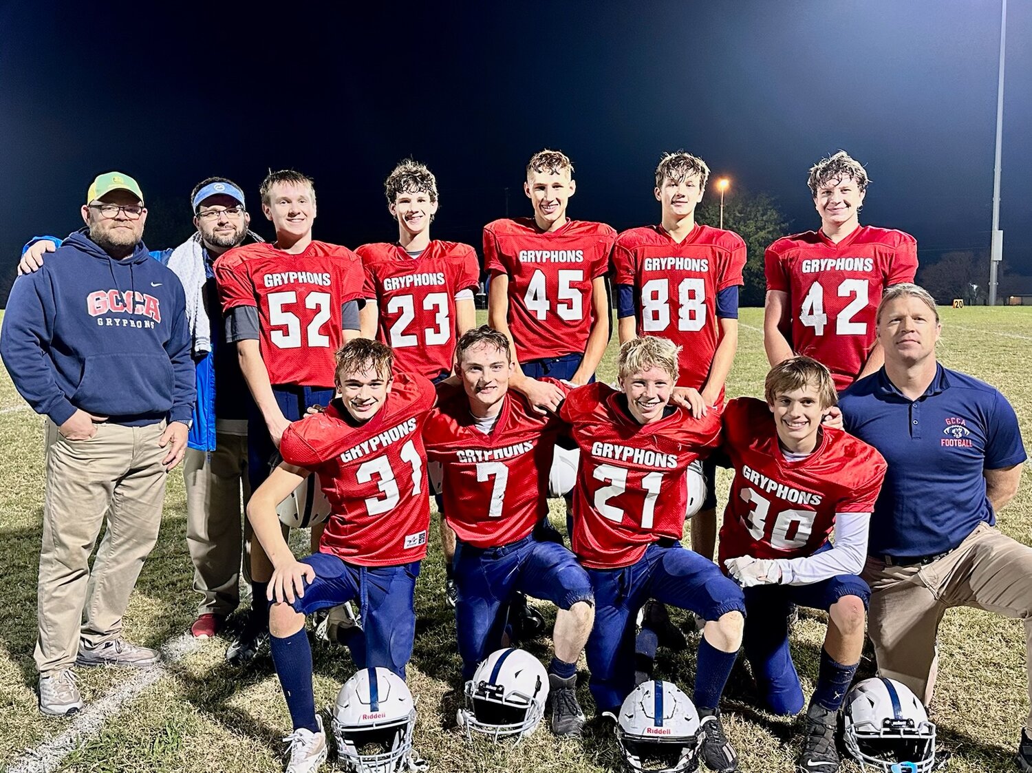 The Grace Classica Christian Academy Gryphons won the Texas Association of Independent Athletic Organizations Division III state championship this past Saturday, defeating Hill County 48-25 in Bryan. Pictured are (back row, from left) head coach Brett Cain, offensive coach Ryan Ray, Drew Ray (freshman), Bryce Jones (junior), Pierce Thomas (sophomore), Tyce Robshaw (junior), Luke Gjone (senior), (front row) Wyatt Keith (sophomore), Noah Bishop (senior), Hudson Gjone (freshman), Lincoln Dolan (freshman) and defensive coach Jim Gjone.