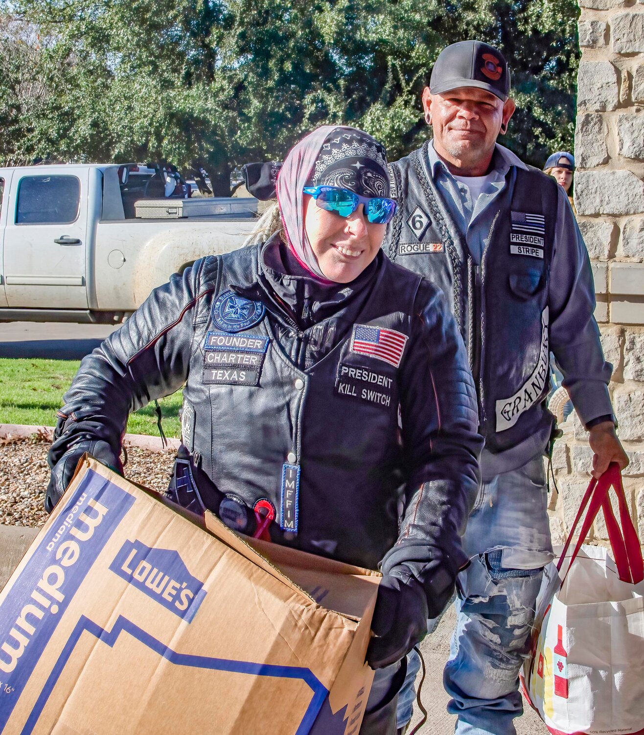 Dawn, front, and Jerry Perales, back, are a husband-and-wife team who combine their motorcycle clubs Iron Maidens and Rogue 22 MC every year to donate Christmas presents to local nursing home residents and staff.