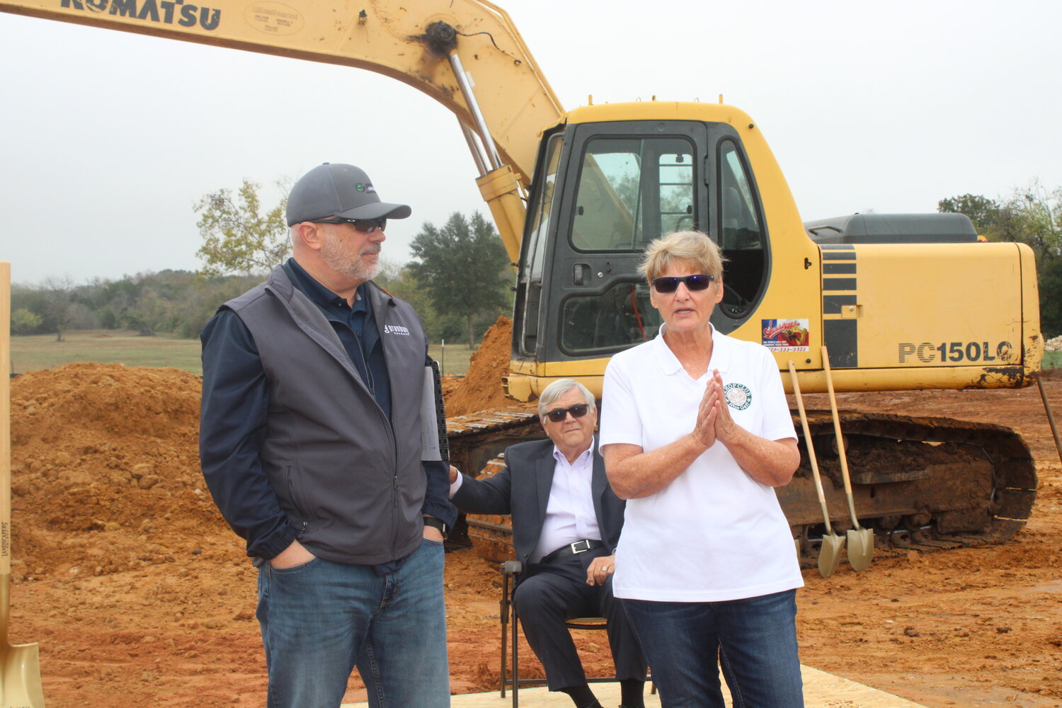 Kim Copeland, CEO of the new premier pickleball facility, right, speaks during the groundbreaking ceremony about what the public can look forward to with the TX HOP Club’s 24,000 square-foot facility. Also pictured are Randy Emerson, vice chairman of ambassador of the Granbury Chamber of Commerce, left, and Tony Callaway, president and CEO of Callaway Development Services, back.