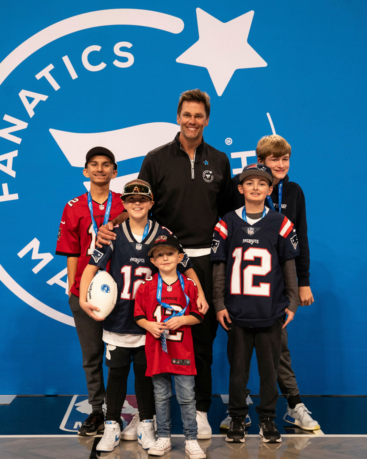 Jax and other recipients of Maek-A-Wish meeting Tom Brady.