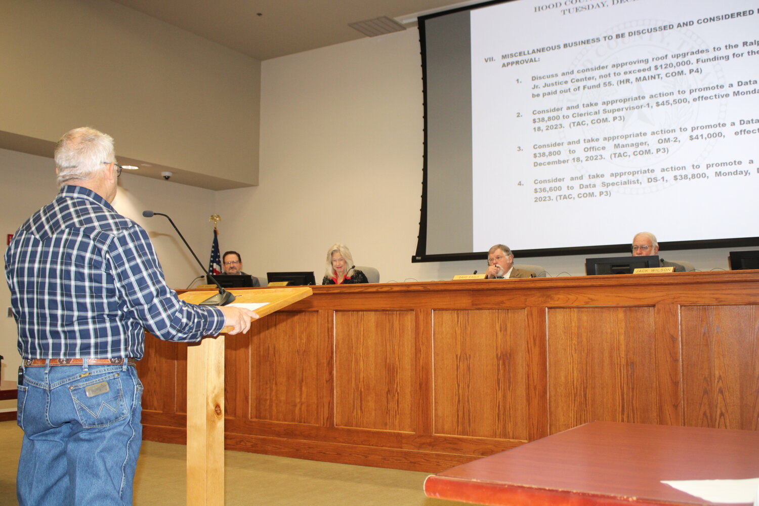 Hood County Maintenance Director Jay Riley, left, speaks to the Hood County Commissioners Court on Dec. 22, as he explains the need for roofing upgrades on the Ralph H. Walton Jr. Justice Center.