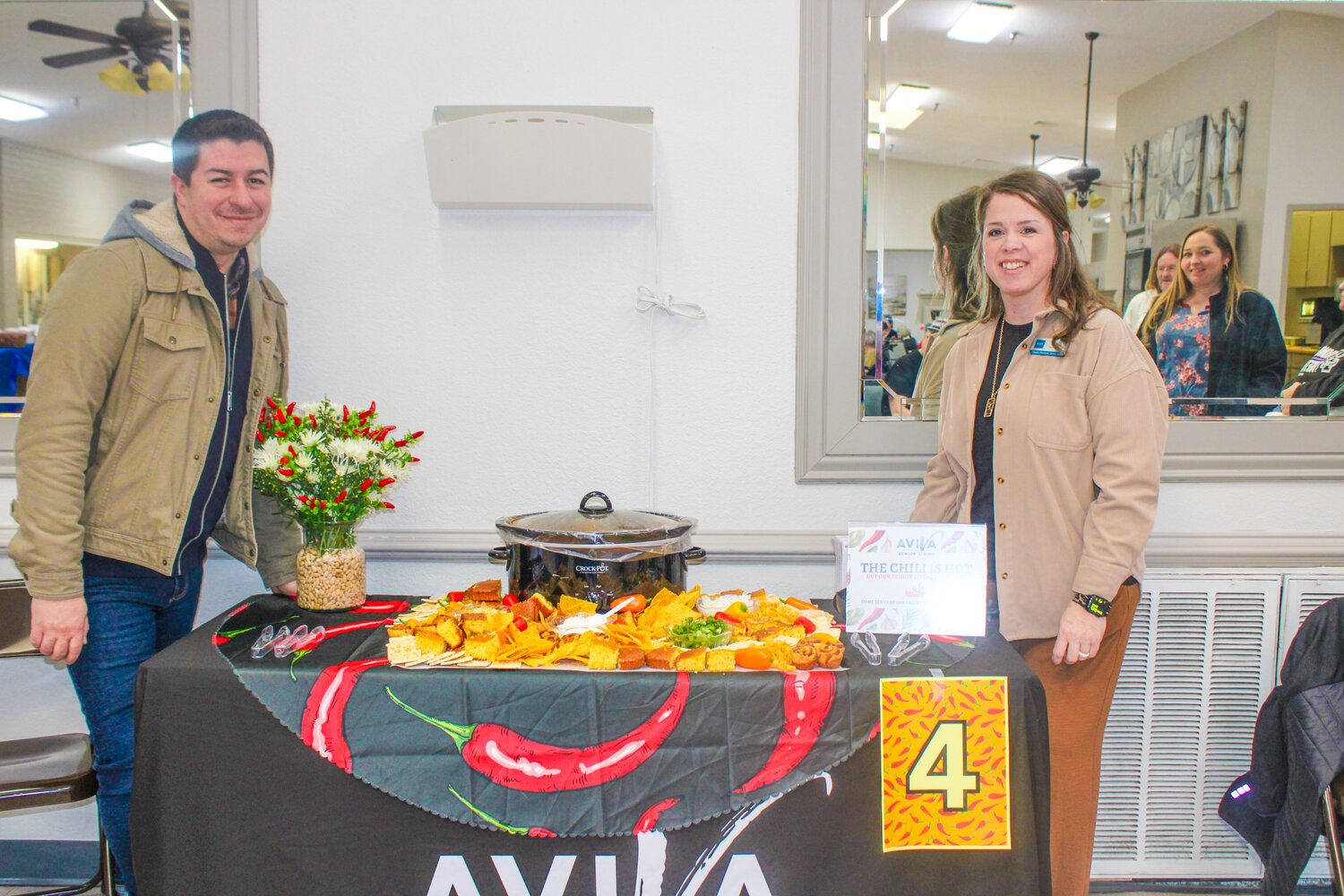 Employees from AVIVA Granbury prepare to dish out their hot and spicy chili recipe during Granbury Care Center’s chili cookoff on Friday, Jan. 12.