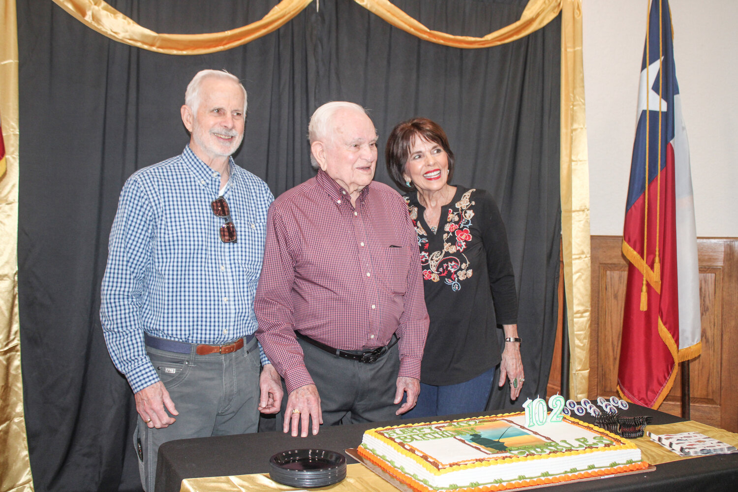 Charles Baldwin celebrates his 102nd birthday at AVIVA Granbury with his son, Rick, and his daughter, Judy.