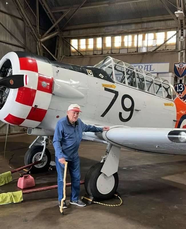 Charles Baldwin is pictured in front of the AT-6 Texan — the same type of airplane that he trained in about 80 years ago.