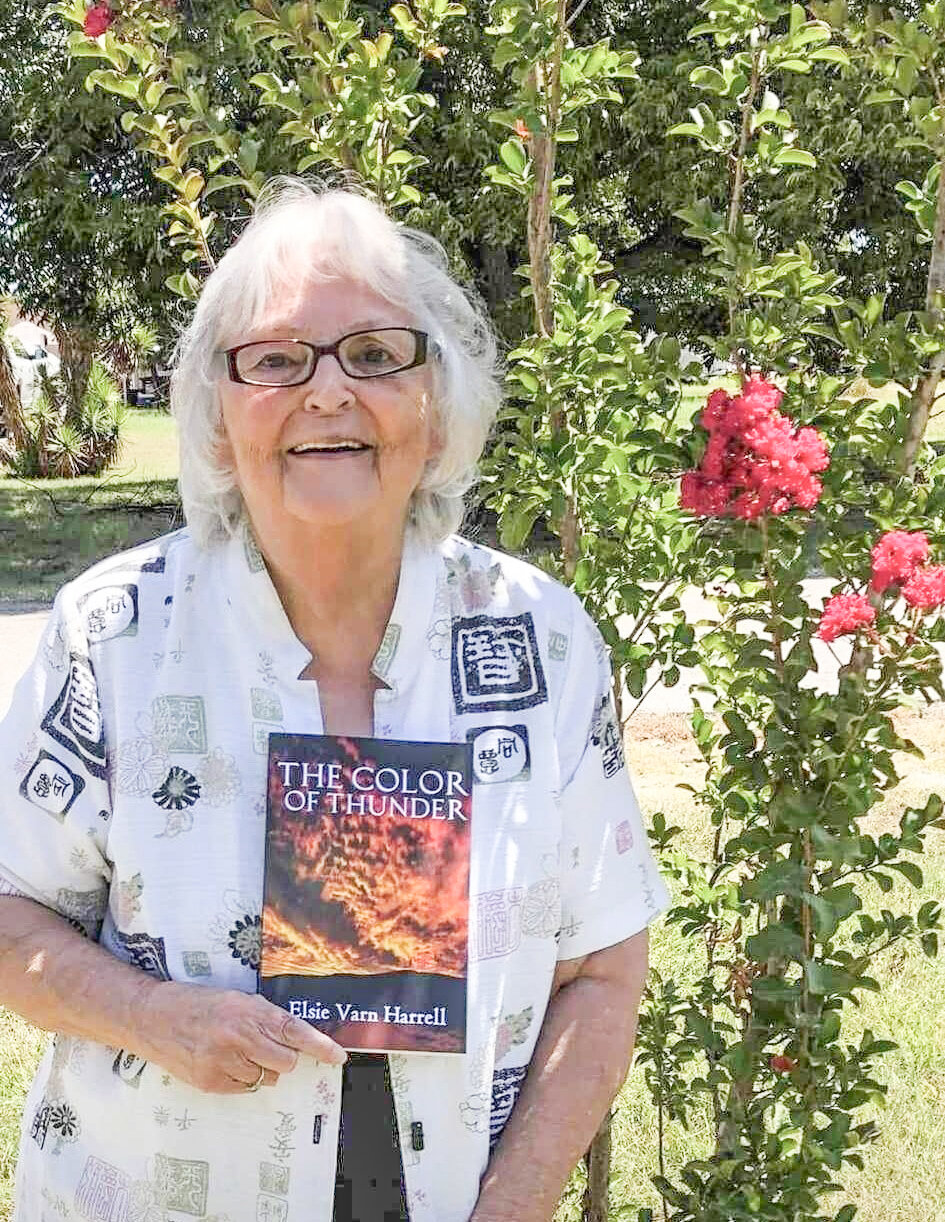 Lipan resident Elsie Harrell is pictured with a book she wrote, “The Color of Thunder,” — a Christian novel about the life story of a minister.