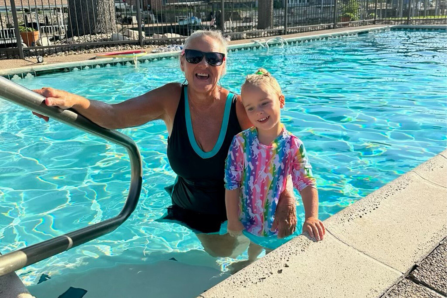 Louise and one of her students at her Granbury home pool.