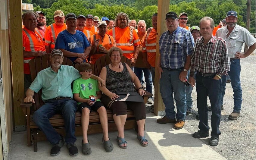 RETIREMENT - Members of the community and the Jackson County Highway Department gathered around Sue Davidson (seated) and her family to wish her well in her retirement after more than four decades with the local office.