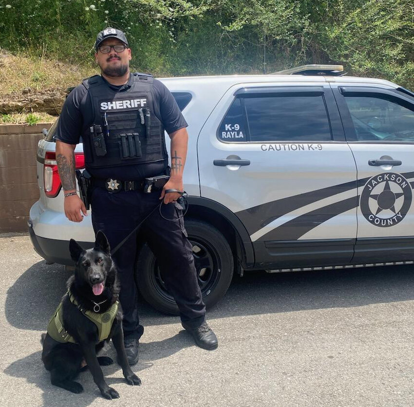 Jackson County Sheriff’s Department K9 Rayla is pictured in her new ballistic vest, alongside fellow JCSD officer Dakota Cuevas.