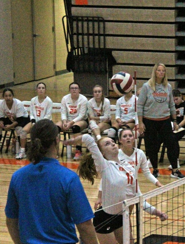 Junior hitter Olivia Boyer records a spike on Tuesday night. The Tigers' play at the net, especially hers, was especially impactful in crawling out of an 0-2 hole to force a fifth set.