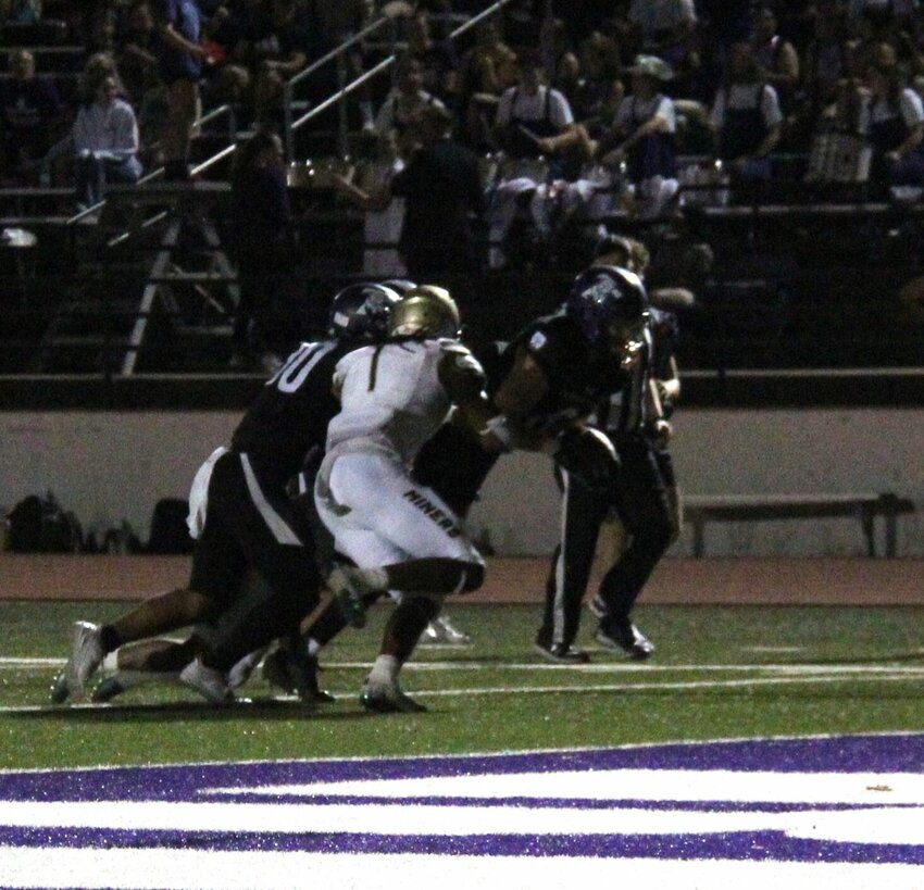 Truman senior Noah Copeland extends one of his two receptions on Saturday evening. Copeland finished with 42 yards.