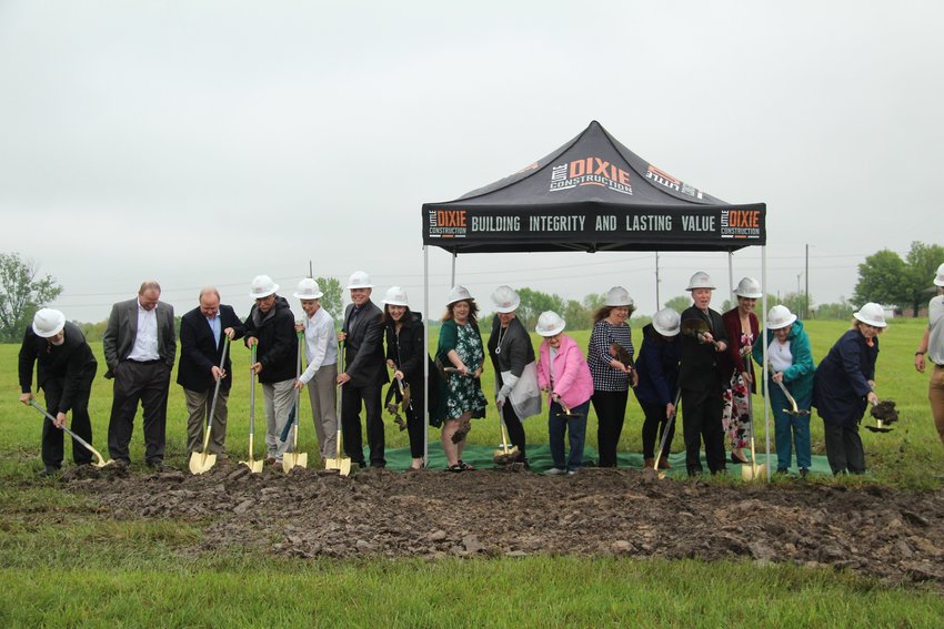 Staff members with Mark Twain Behavioral Health put shovels to dirt Tuesday as part of a groundbreaking ceremony for the company's new Kirksville facility.