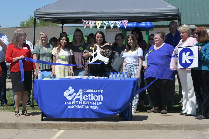 Tiffany Youngman, the center supervisor of the new Pfeiffer Avenue Early Head Start Center, cuts the ribbon at Wednesday's ceremony to celebrate the facility's opening.
