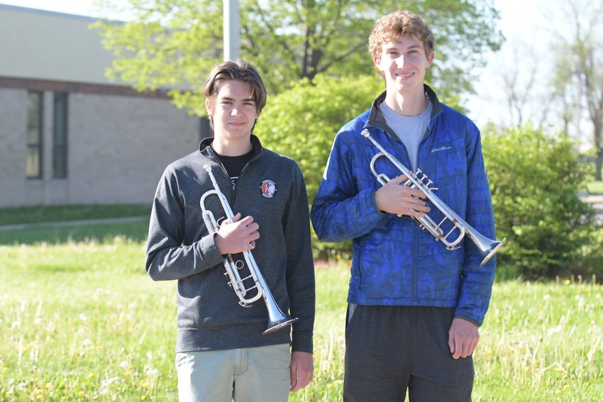 Kirksville All-State Band honorees Patrick Jennings, left, and Evan AuBuchon, right, pose with their trumpets.