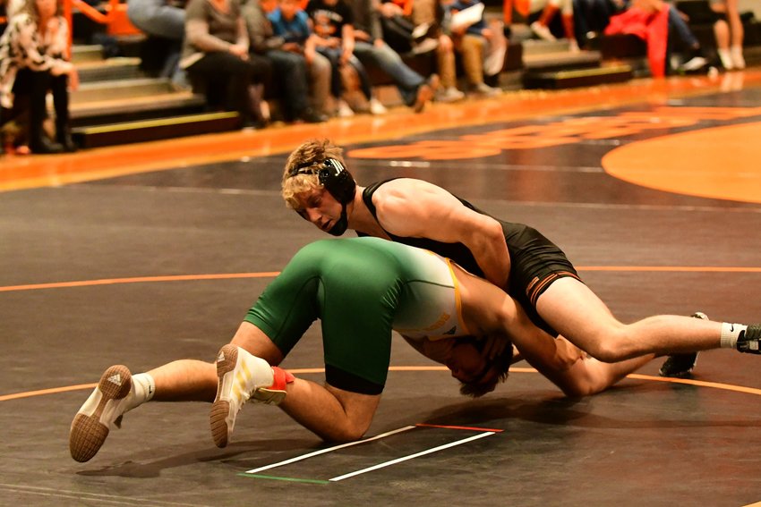 Kirksville's Dominic Cahalan holds control of Rock Bridge's Benjamin Cardetti before securing a pinfall win on Tuesday night.