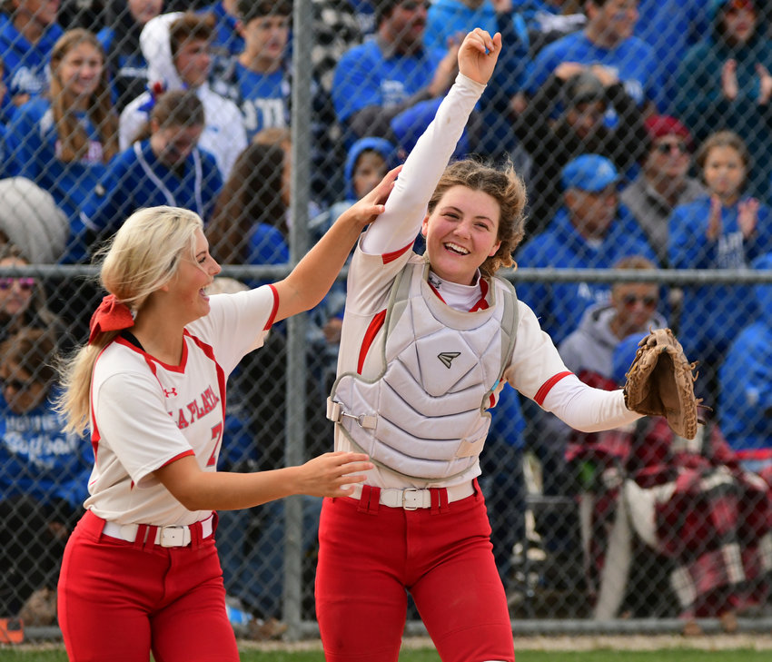 La Plata's Olivia and Claire Coy celebrate after winning a state quarterfinal softball game against Atlanta.