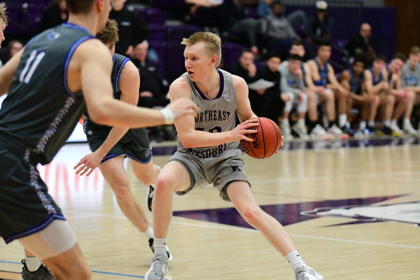 Truman's Masen Miller looks to make a pass during a GLVC Tournament game against Rockhurst on Feb. 28, 2022.
